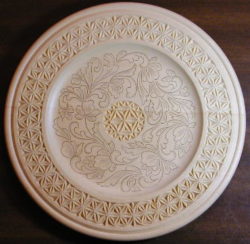 Chip carved and kolrosed plate by Judy Ritger